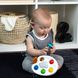 Музична розвиваюча іграшка Baby Einstein "Color Palette Popper"